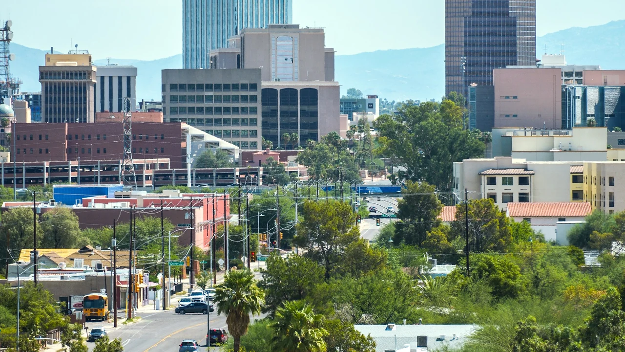 Downtown Tucson cityscape with streets, buildings, and desert vegetation.