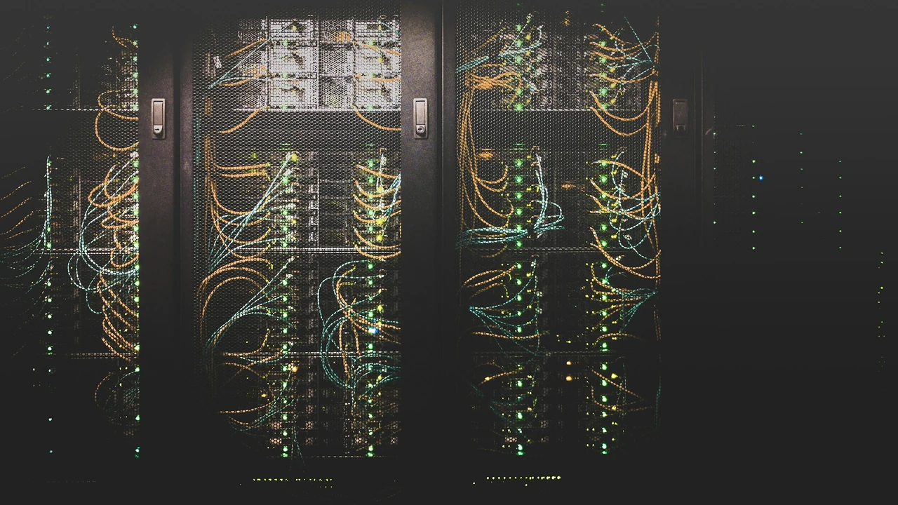 Organized network cabling inside a working data center.