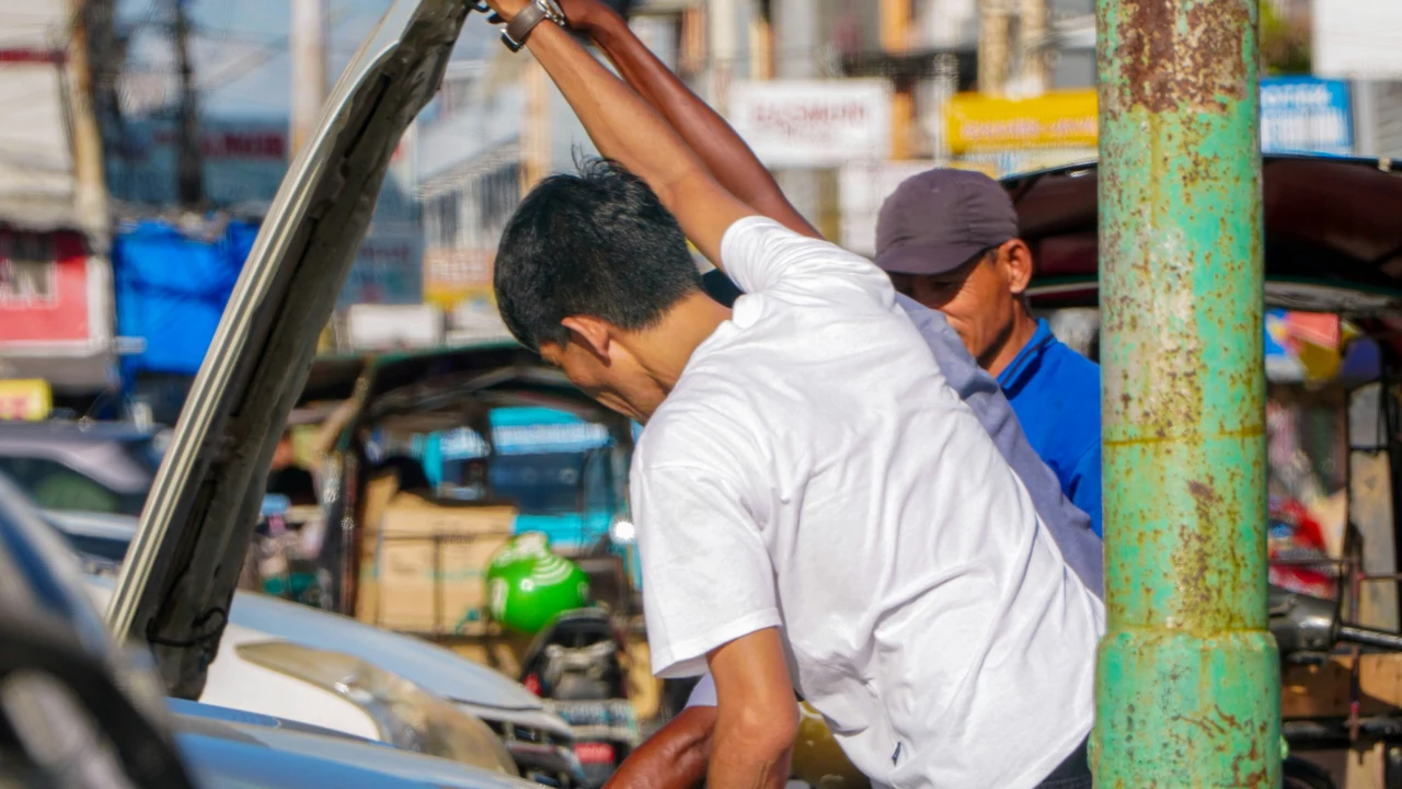 Mechanic repairing a real vehicle.