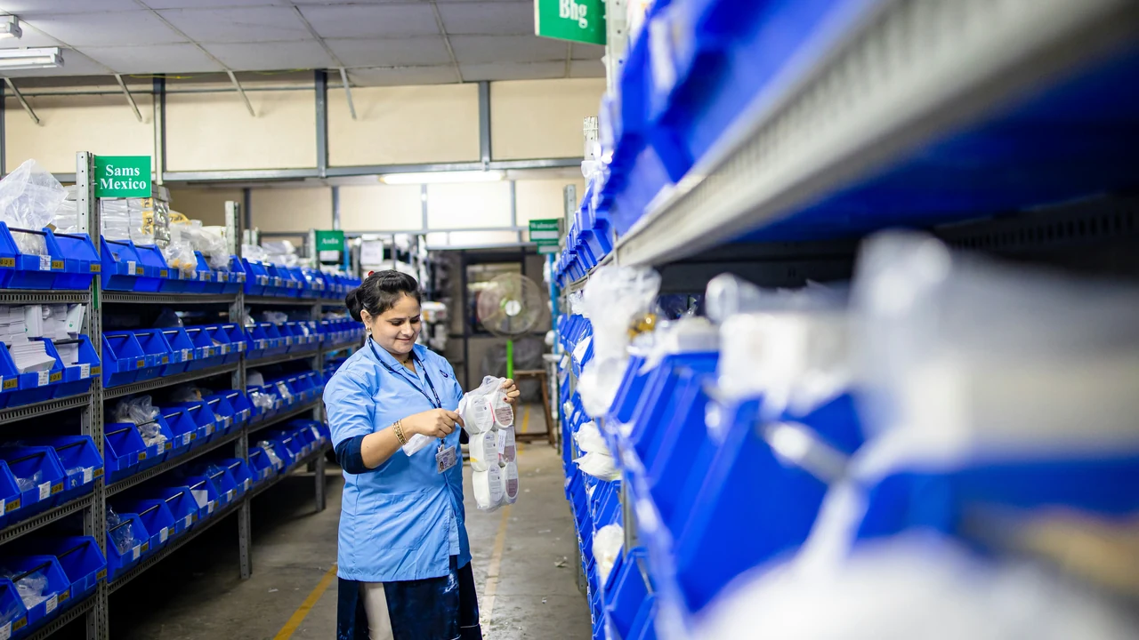 Worker in an organized fulfillment warehouse.