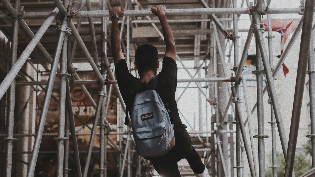 Authentic photograph of man on scafold.