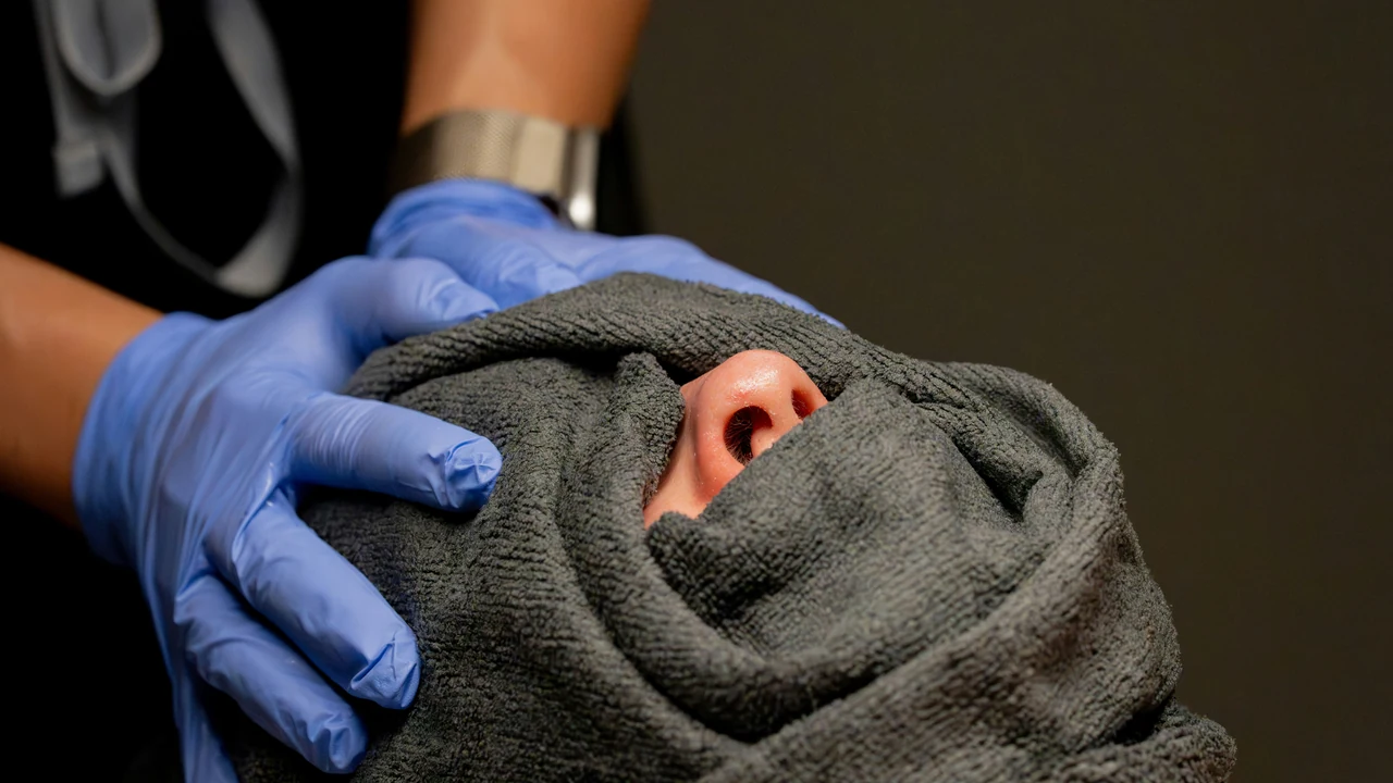 Authentic photograph of spa treatment with a towel covering the face.