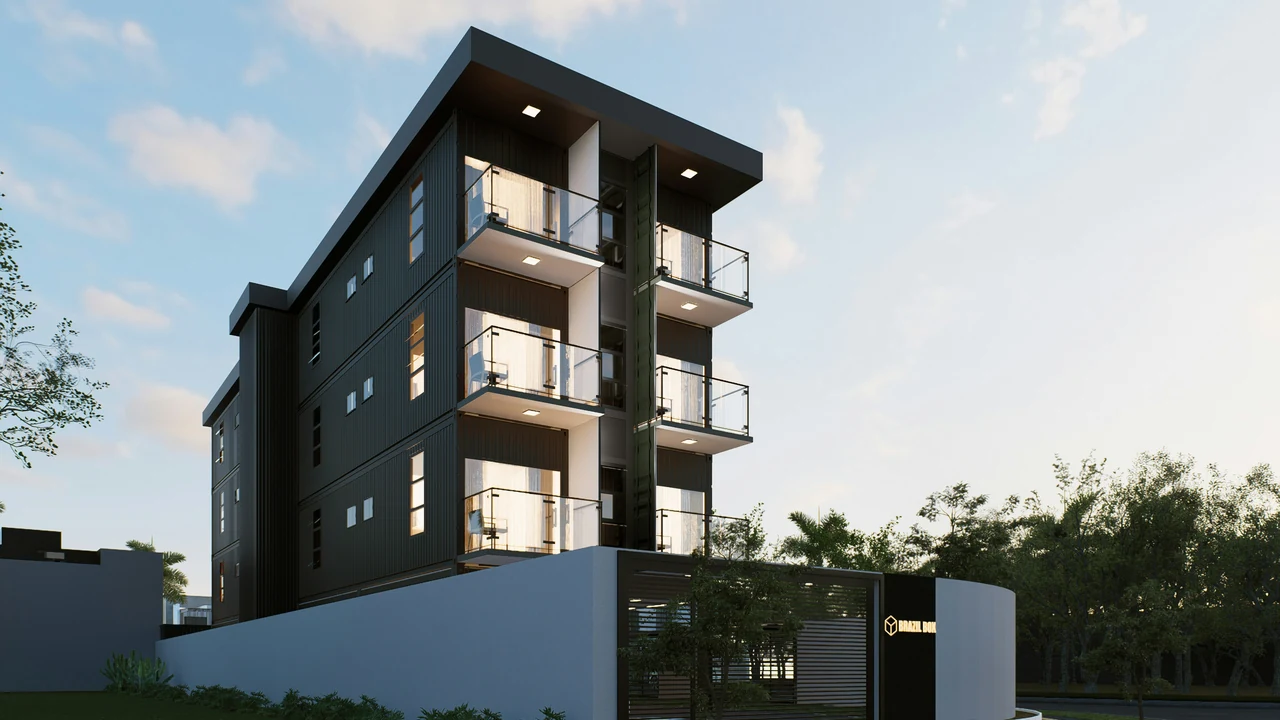 Authentic photograph of modern apartment building with balconies and large windows.