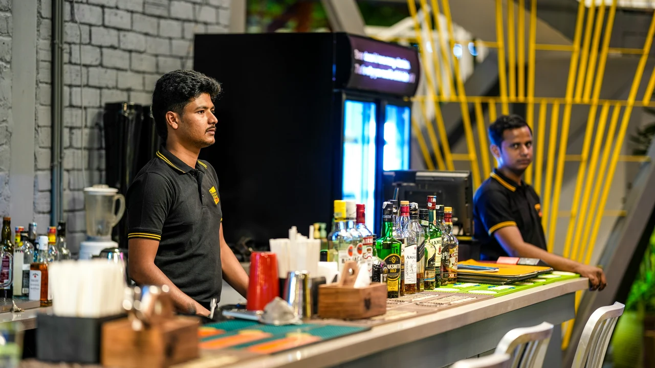 Bartenders working behind a real bar.
