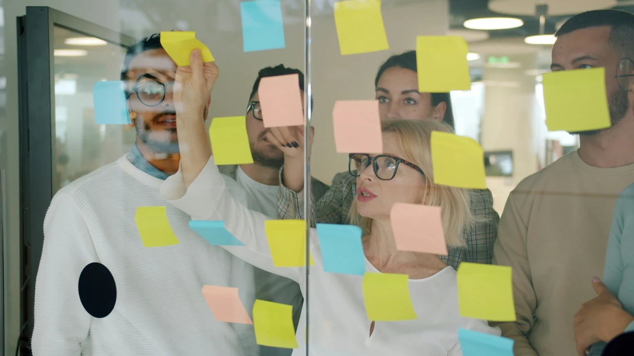 Team brainstorming with sticky notes.