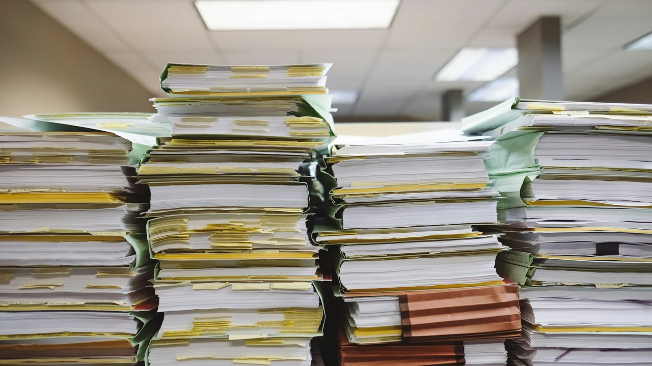 Authentic photograph of stack of books on table.