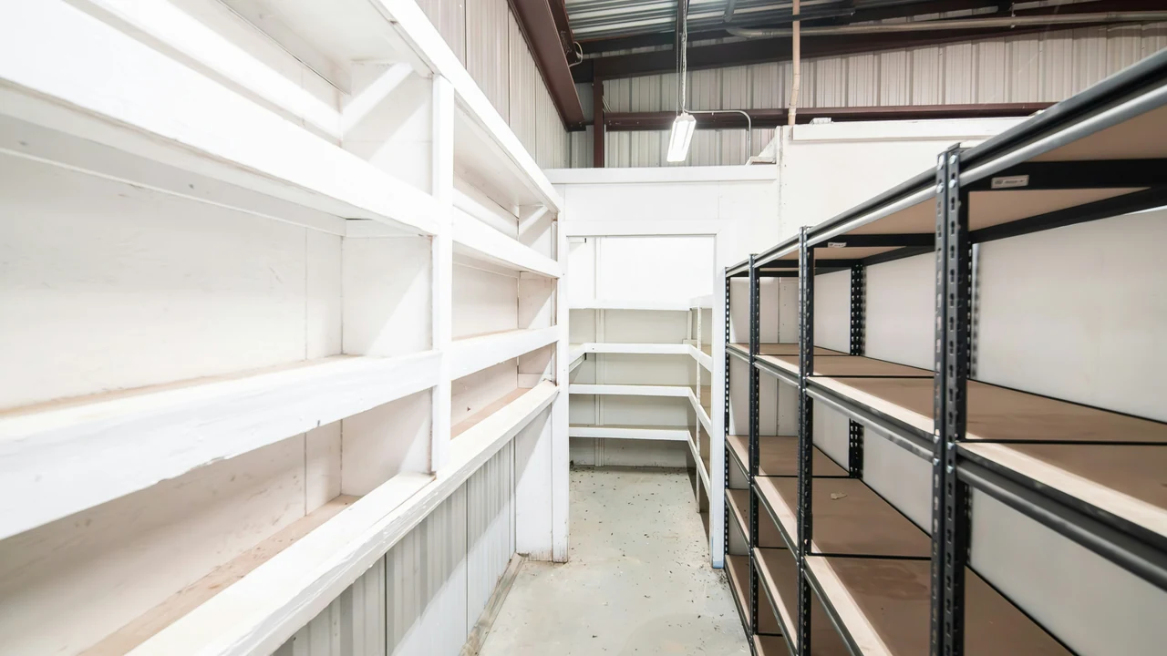 Authentic photograph of a long row of shelves in a warehouse.