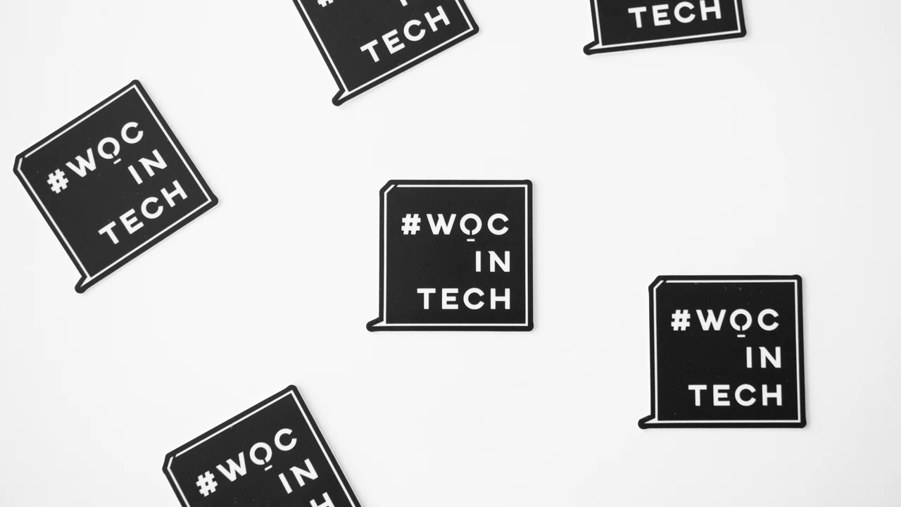 Authentic photograph of woc in tech texts.