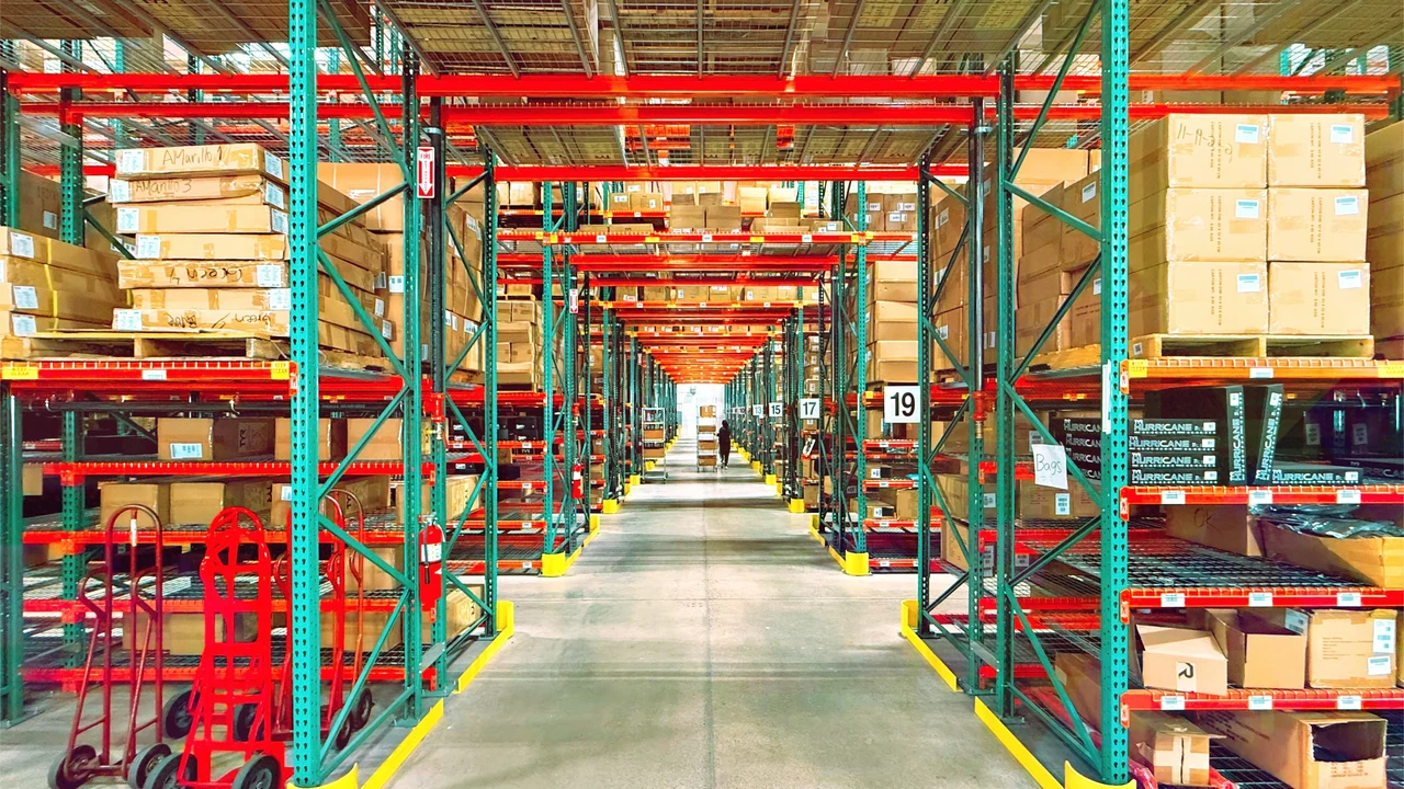 Authentic photograph of a warehouse is filled with shelves and boxes.
