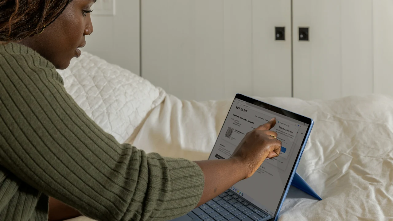 Professional managing a search advertising account on a laptop.