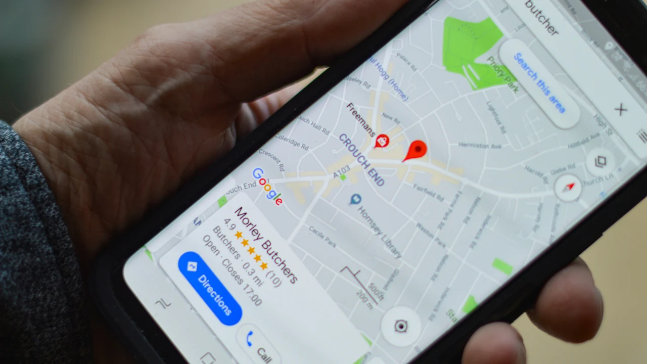 Person using a smartphone map to find a nearby local business.
