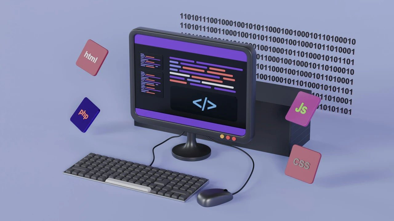Desktop computer displaying website development code.