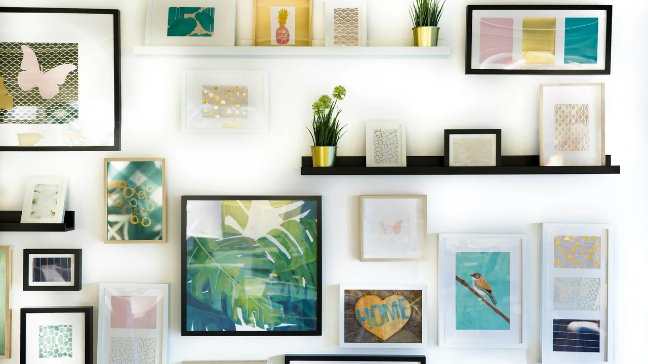 Curated framed artwork arranged on a gallery wall.