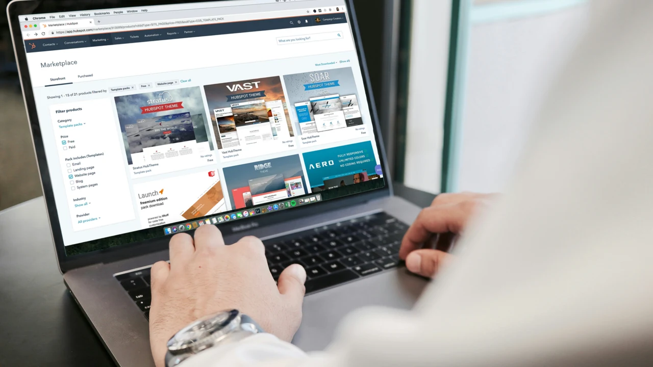 Person using a MacBook for focused digital work.